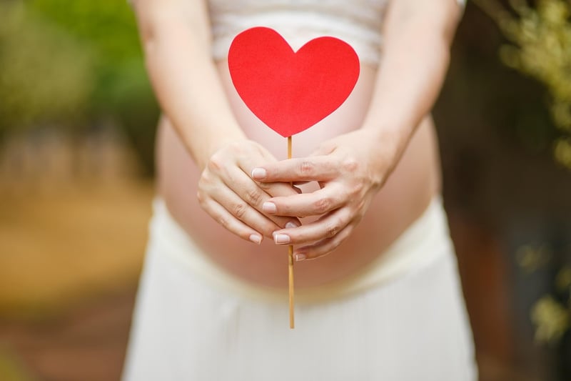 Pregnant woman practicing prenatal pilates